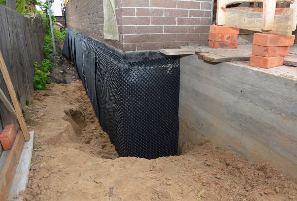Happy homeowners after waterproofing job in Valley Stream